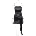 Detail van een strapless polkadotjurk met tailleband en patchwork ontwerp - S / Zwart