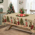 Christmas tablecloth detail featuring Santa, reindeer, and tree on a wooden dining table - Zb695-13