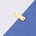 Macro detail of gold-plated rectangular bar charm with double holes for jewelry making - Gold Double Hole