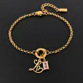 14K gold plated stainless steel bracelet with stylized letter L and pink crystal charm - Letter L