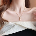 Elegant gold plated necklace with fish tail tassel and white pearl on model neck - 26# Necklace - Carved Flower Pearl Pendant Style