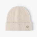Creamy white feather yarn beanie with golden M letter emblem for winter warmth - Beige