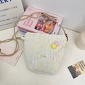Cream canvas crossbody phone bag with colorful stripes and pastel pompom charms - Creamy White