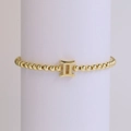 Detailed view of 18k gold plated beaded bracelet with Gemini zodiac sign pendant - Gemini