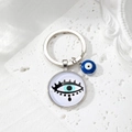 Detail of silver Evil Eye keychain with blue glass beads on elegant stone surface - 6# Black Eyelash Eye