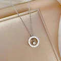 Detailed macro view of silver titanium steel Roman numeral pendant with round crystal - Titanium Steel / Silver