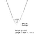 Polished stainless steel heart pendant necklace with letter J engraving on white background - Letter J