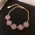 Bracciale placcato oro 18K con cinque fiori in zircone viola e chiusura a moschettone - Oro-Viola