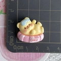 Detailed scale view of a 2.5cm yellow bear resin charm on a pink swim ring - Bear with Swim Ring