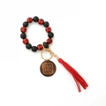 Detail of red black plaid wooden bead bracelet keychain with tassel and MAMA engraved disc - Red
