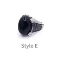 Detail view of Style E vintage men's ring with black oval gemstone and silver band - US 8 / Style E
