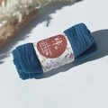 Detail of dark blue pleated cotton scarf wrapped in floral paper with handmade labels - Style #114