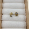 Chic four-claw stud earrings featuring raw natural amethyst stones in golden setting - Tiger's Eye