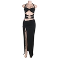 Detail of black halter crop top with gold metal buckle and side slit drawstring skirt - S / Black