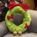 Green plush Christmas wreath pillow with red bows and smiley face on gray sofa - Flower Garland / 20cm