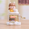 Detail of mechanical music box with cute girl figurine and a sweet rainbow base - Cute Girl Yellow Dress