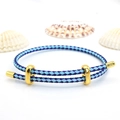 Detail view of adjustable blue braided rope bracelet with polished gold metal buckles - 2mm Semi-finished (Single End Fixed) / Blue-Dark Blue