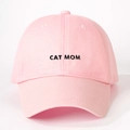 Close-up of CAT MOM black embroidery on a pink cotton twill baseball cap fabric - CAT MOM Embroidery / Pink