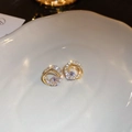 Macro detail of gold-plated geometric interlocking hoop earrings with sparkling cubic zirconia - Silver Pin - Zircon Circle Stud Earrings / Gold
