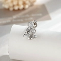 Silver bow cartilage stud earring with sparkling cubic zirconia in high-polish finish - Bow Christmas Tree (Single)
