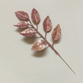 Macro detail of rose gold glitter artificial leaves for Christmas DIY tree decorations - Pink