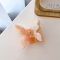 Elegant butterfly hair claw clip with pink and cream marble texture acetate finish - Light Pink