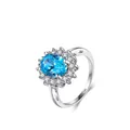 925 silver ring featuring an oval blue gemstone surrounded by sparkling white stones - Aqua