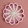 Handmade crochet flower coaster with gradient pink chenille yarn and white scalloped edge - Pink Gradient