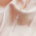Silver star ear crawler earring with zircon inlay on a soft pink satin fabric - Four-Pointed Star Style (DZ-708)