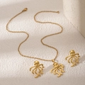 Golden octopus jewelry set including necklace and stud earrings on textured background - Octopus Shape Style (E3397-2)