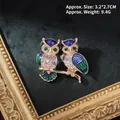Detailed view of baroque owl brooch with blue enamel and rhinestones 3.2x2.7cm - Owl