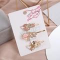 Détail des barrettes ciel étoilé avec lune et étoiles sur une carte décorative - Combo Rose