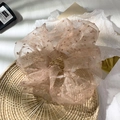 Elegant nude mesh scrunchie with polka dot pattern on a rustic rattan tray - Dusty Rose