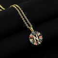 Golden necklace with circular 'N' letter pendant featuring colorful cubic zirconia stones - Gold Plated Rainbow Zirconia Letter N