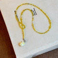 Colorful yellow seed bead necklace with a white conch shell pendant for beach vacations - Glass Bead Ceramic Shell Star Fish Pendant Necklace