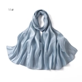 Detailed view of light blue satin scarf texture with silky sheen and soft draped edges - Light Blue