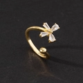 Detail shot of open gold ring featuring two pear and two rectangular cut zircon stones - Style O-Gold Four Stone Zircon Row