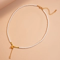Elegante Perlenkette mit goldenem Kürbis-Anhänger und Zirkon-Detail für Damen - Halskette-Weiß