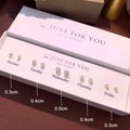 Detail view of five pairs of gold-plated cubic zirconia stud earrings in various sizes - Set of 5 Pairs Gold Claw Zirconia Style (NS-11031-11)