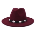 Detailed close-up of wine red fedora hat with black belt and silver metal accents - Burgundy