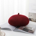 Burgundy wool beret hat with fuzzy texture for women shown on a magazine lifestyle scene - One Size / Burgundy