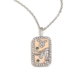 Silver Taurus zodiac necklace with pink enamel and diamond accents on a chain - Taurus / Silver