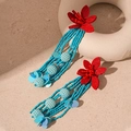 Detail of long tassel earrings featuring red floral studs and blue beaded strands - Red Flower Blue Tassel (Silver Pin)