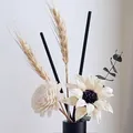 Handmade white Sola flowers with dried wheat in a black minimalist vase for home decor - Infinity Oolong