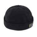 Detalle de textura de pana negra y etiqueta decorativa en el gorro sin ala - M (56-58cm) / Negro