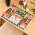 Christmas knitted placemat featuring Santa Claus and snowflakes on a wooden table setup - Santa Claus