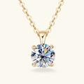 Detail of a gold moissanite pendant featuring a brilliant round cut stone in 4-prong setting - 3 ct / Gold