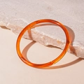 Artistic close-up of translucent amber acrylic bangle on a textured stone surface - Coffee Thin Style (11#)