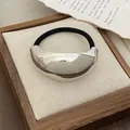 Minimalist black elastic hair tie featuring a polished silver crescent moon metal buckle - GD443 Silver Wide Arc