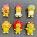 Set of six yellow duck stress relief toys with various cute headwear on a grey base - Small Yellow Duck 7cm